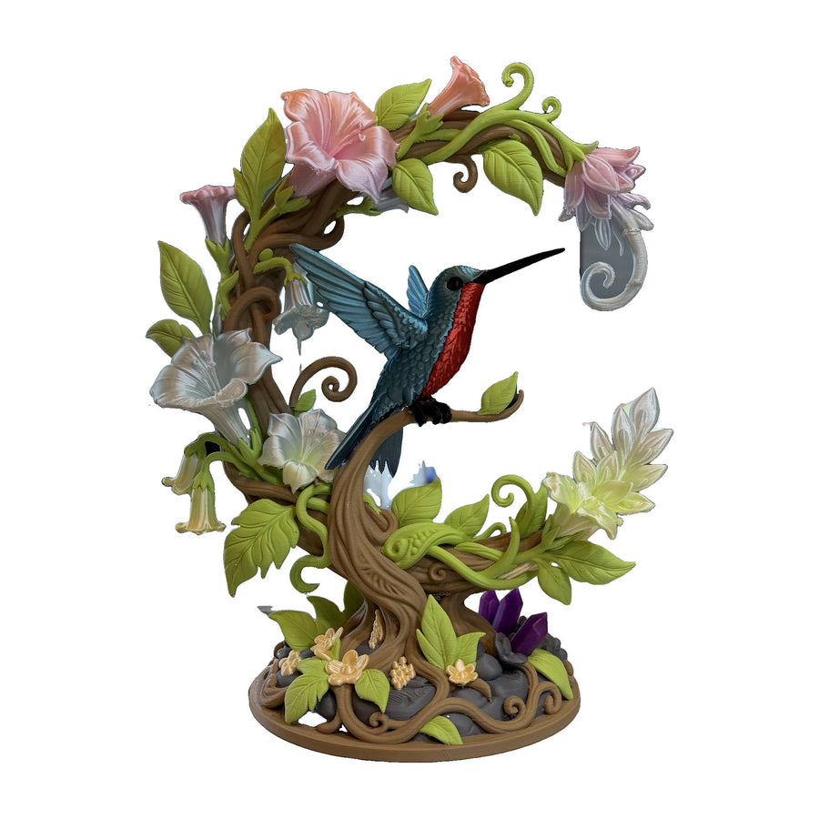 Hand-painted hummingbird and blossom sculpture, Spring Blossom colorway, free-standing on a round base